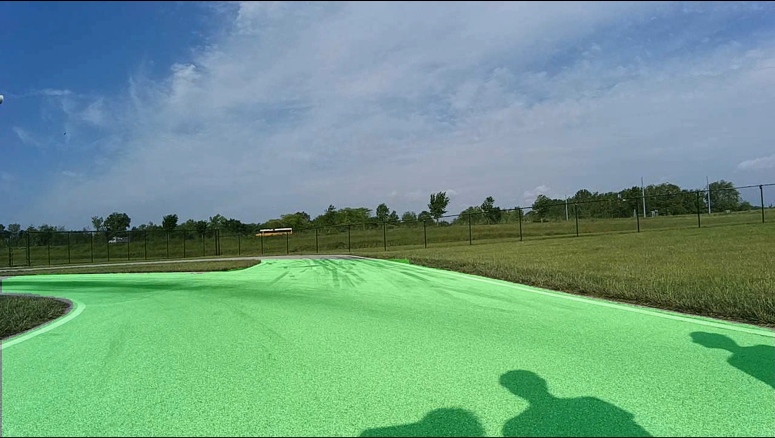YOLO11 road segmentation — drivable region overlaid in green