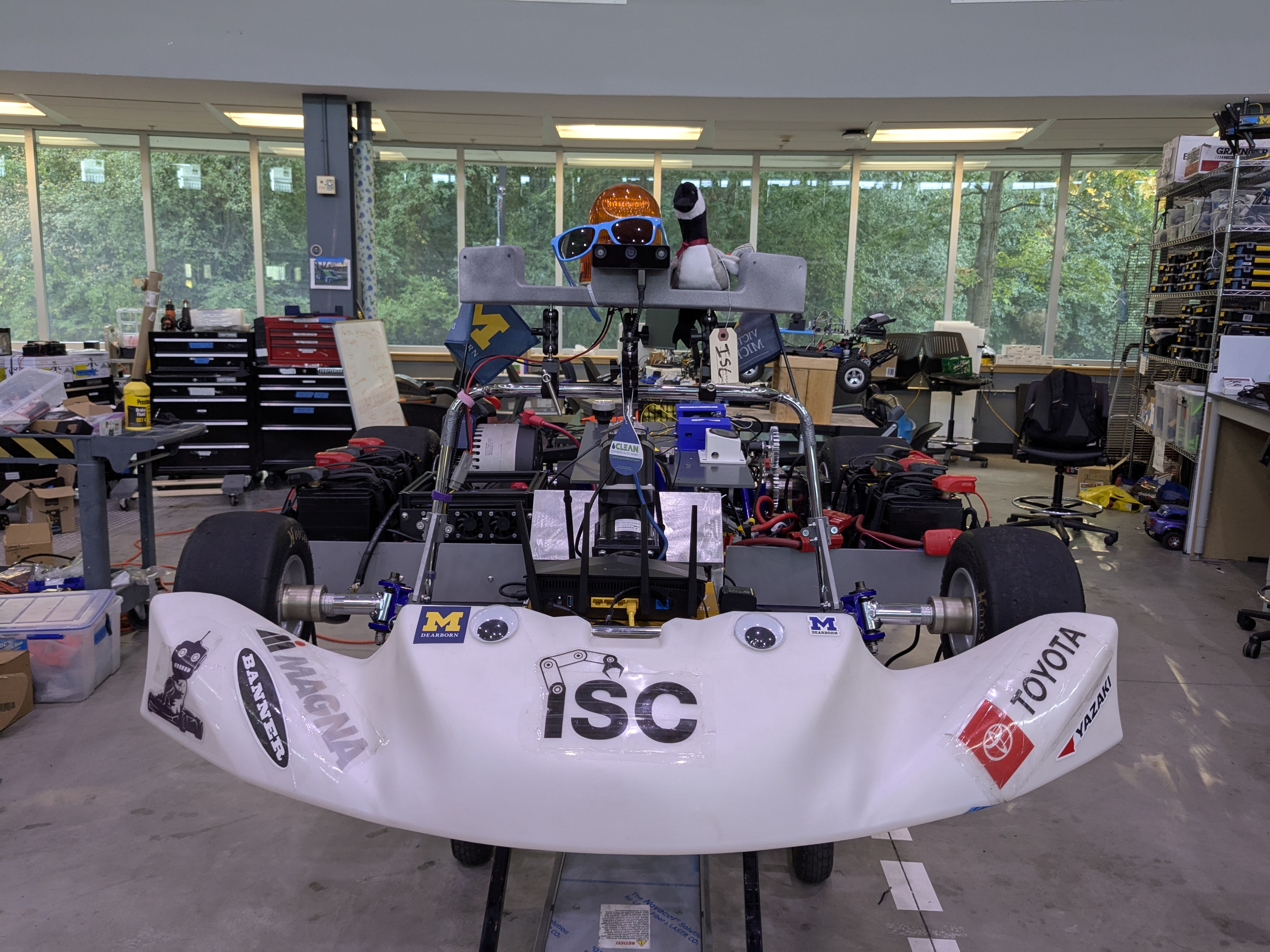 The autonomous go-kart with ISC bodywork and roof-mounted perception rig