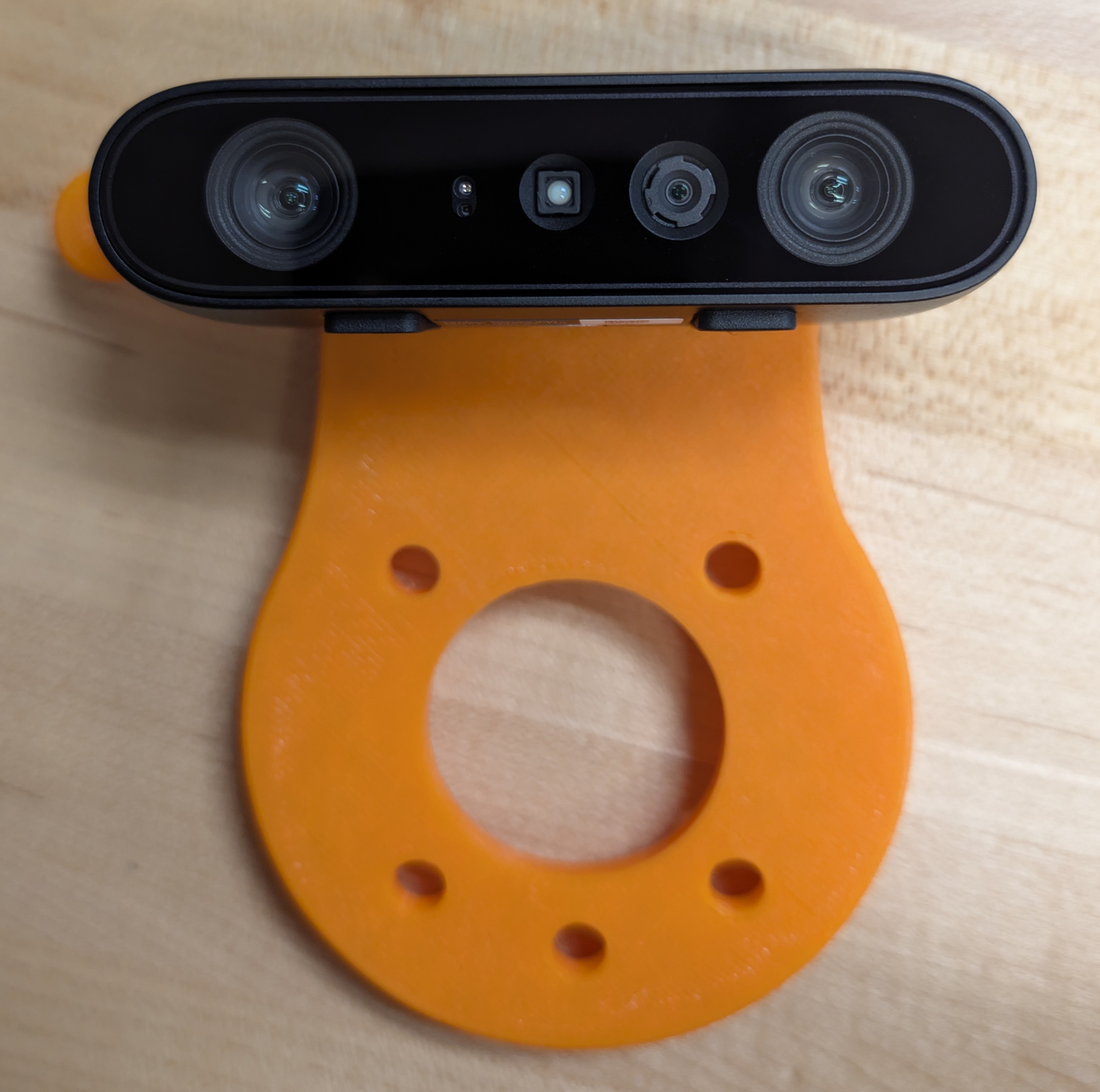 Orbbec Gemini 335 depth camera on a 3D-printed orange mount